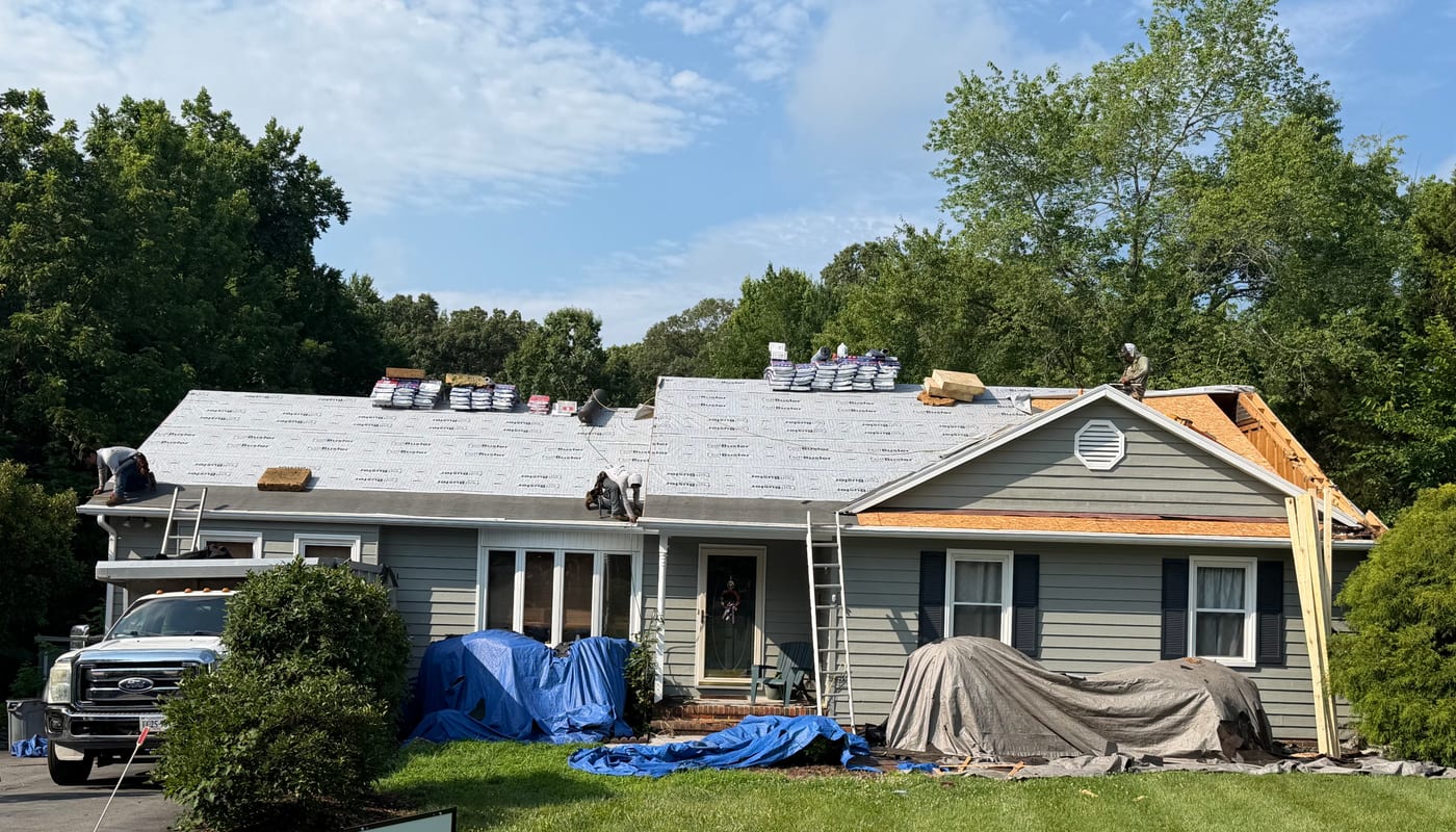 DHBerry Construction crew installing new roof decking and underlayment on a Virginia home
