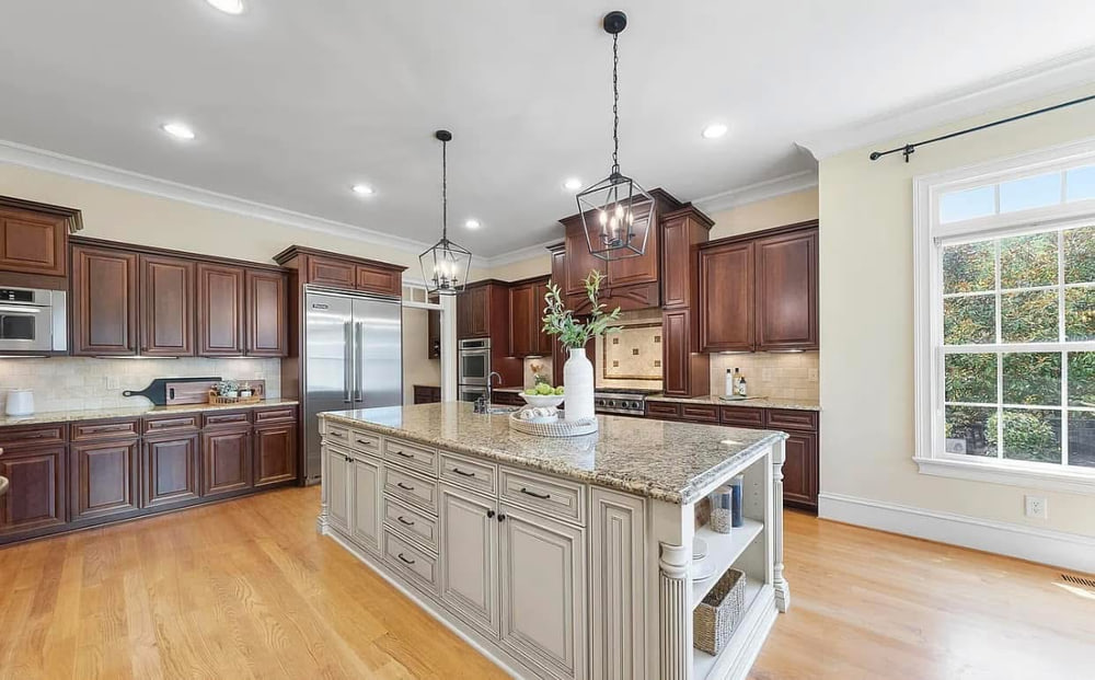 Traditional cherry kitchen with large granite-topped island