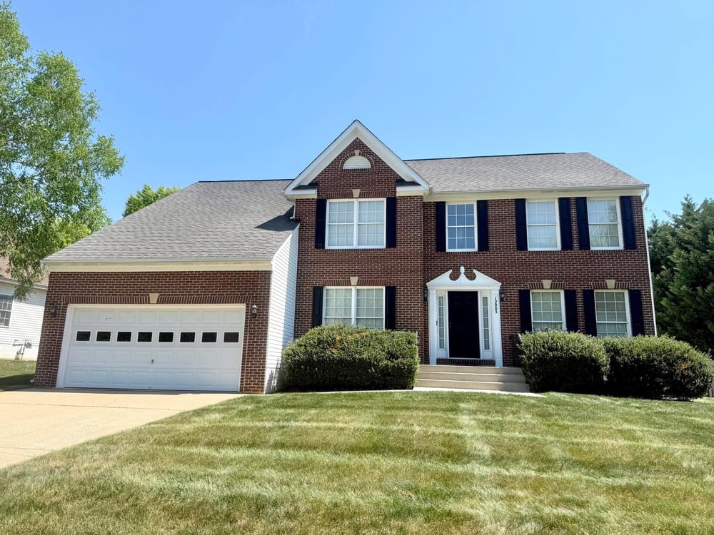 New shingle roof on a two-story brick colonial home in Virginia